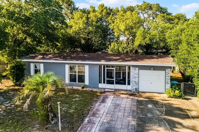 1649 Weybridge St, Deltona, FL 32725 - ranch-style home featuring an attached garage, a shingled roof, concrete driveway, and concrete block siding