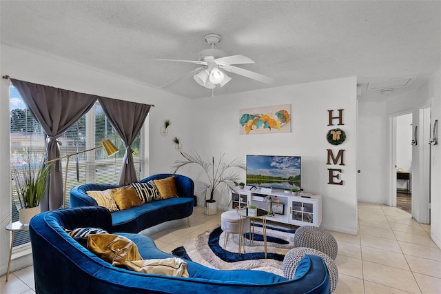 1649 Weybridge St, Deltona, FL 32725 - living area featuring light tile patterned floors, ceiling fan, and a textured ceiling
