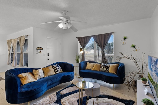 1649 Weybridge St, Deltona, FL 32725 - tiled living area with ceiling fan and a textured ceiling
