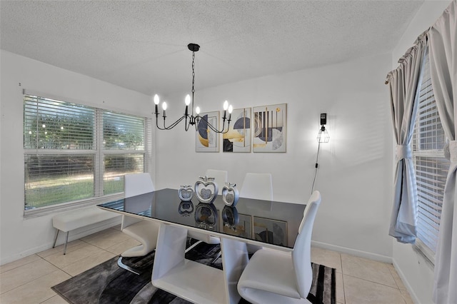 1649 Weybridge St, Deltona, FL 32725 - dining space with a chandelier, light tile patterned floors, and a textured ceiling