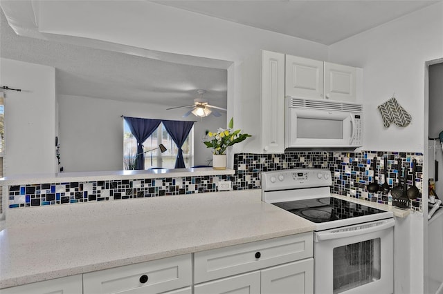 1649 Weybridge St, Deltona, FL 32725 - kitchen featuring white appliances, backsplash, white cabinetry, and plenty of natural light