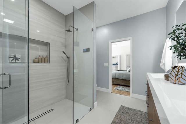 9353 Gotha Rd, Windermere, FL 34786 - full bathroom with a stall shower, vanity, ensuite bath, and tile patterned flooring