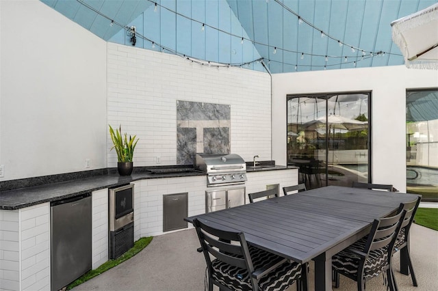 9353 Gotha Rd, Windermere, FL 34786 - view of patio featuring exterior kitchen and outdoor dining space