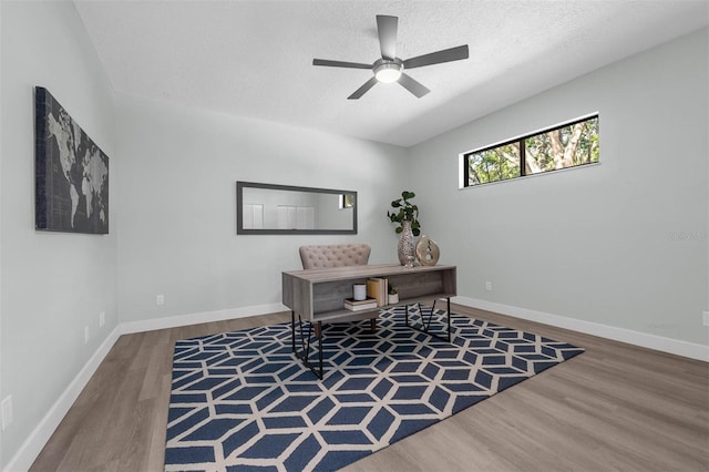 9353 Gotha Rd, Windermere, FL 34786 - home office with wood finished floors, a ceiling fan, and a textured ceiling