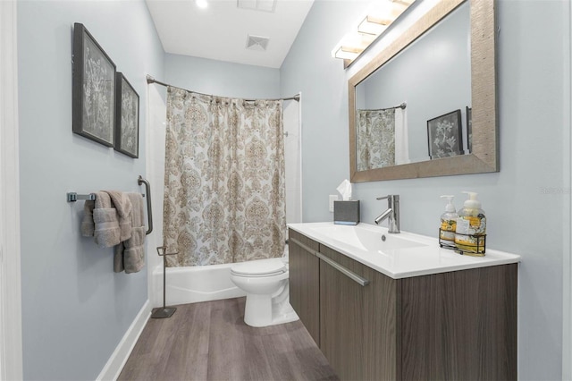 9353 Gotha Rd, Windermere, FL 34786 - bathroom featuring vanity, wood finished floors, and shower / bath combo with shower curtain