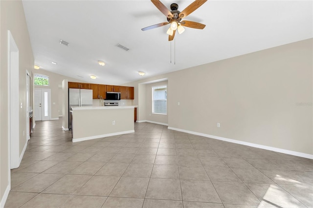 1753 Sage Creek Ct, Orlando, FL 32824 - unfurnished living room with light tile patterned floors, lofted ceiling, and ceiling fan