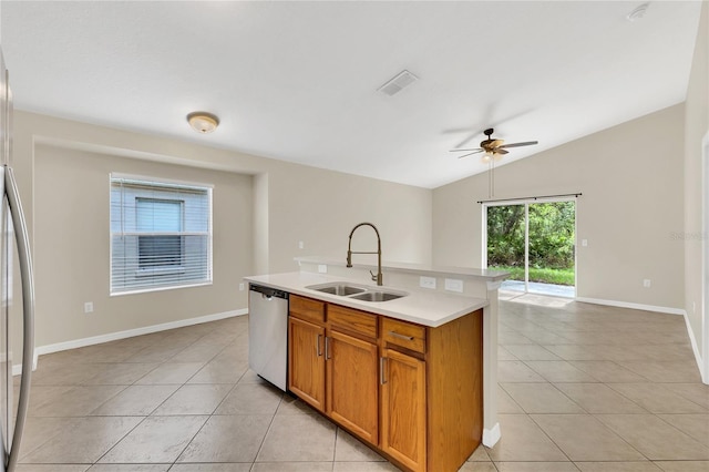 1753 Sage Creek Ct, Orlando, FL 32824 - kitchen featuring stainless steel dishwasher, light tile patterned flooring, light countertops, ceiling fan, and open floor plan
