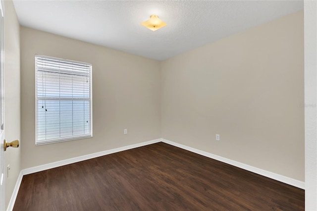 1753 Sage Creek Ct, Orlando, FL 32824 - unfurnished room with dark wood-style flooring