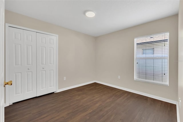1753 Sage Creek Ct, Orlando, FL 32824 - unfurnished bedroom with dark wood-style flooring and a closet