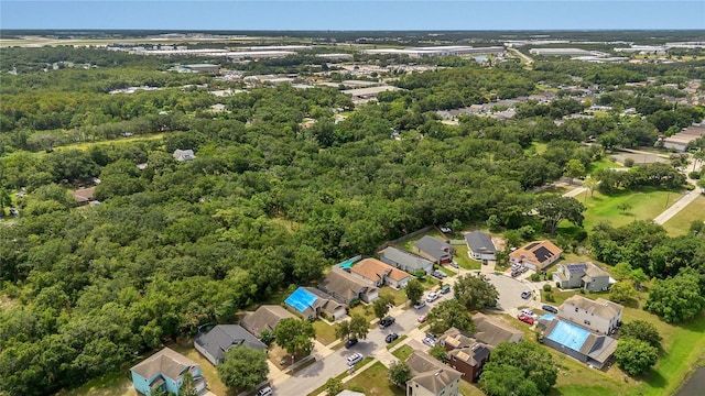 1753 Sage Creek Ct, Orlando, FL 32824 - aerial view of residential area featuring a heavily wooded area