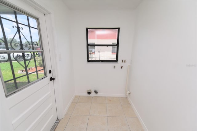 4469 Evers Pl, Orlando, FL 32811 - washroom with light tile patterned flooring and hookup for a gas dryer