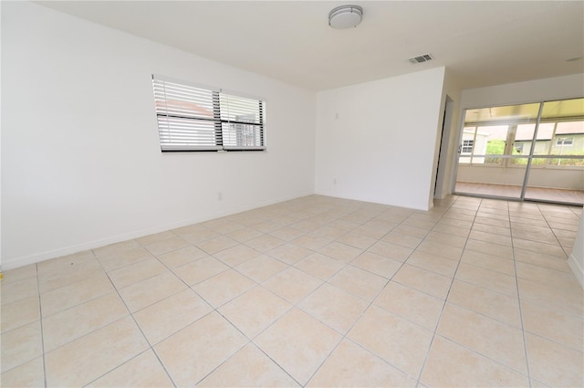 4469 Evers Pl, Orlando, FL 32811 - empty room with light tile patterned floors