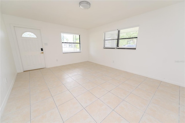 4469 Evers Pl, Orlando, FL 32811 - foyer entrance with light tile patterned floors and baseboards