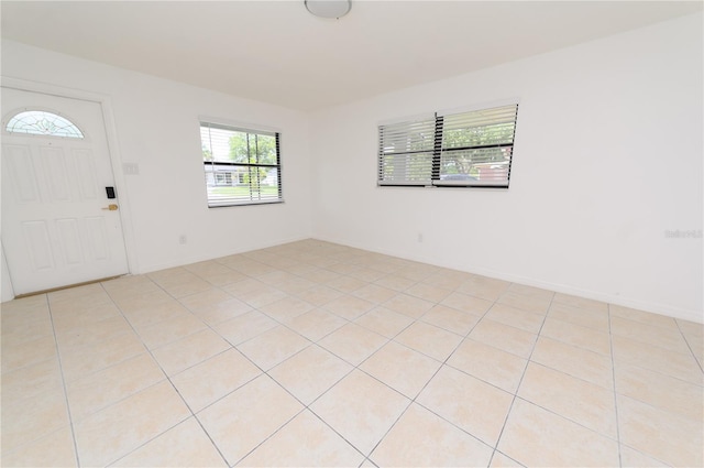 4469 Evers Pl, Orlando, FL 32811 - entryway featuring light tile patterned flooring and baseboards