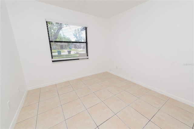 4469 Evers Pl, Orlando, FL 32811 - unfurnished room featuring light tile patterned flooring and baseboards