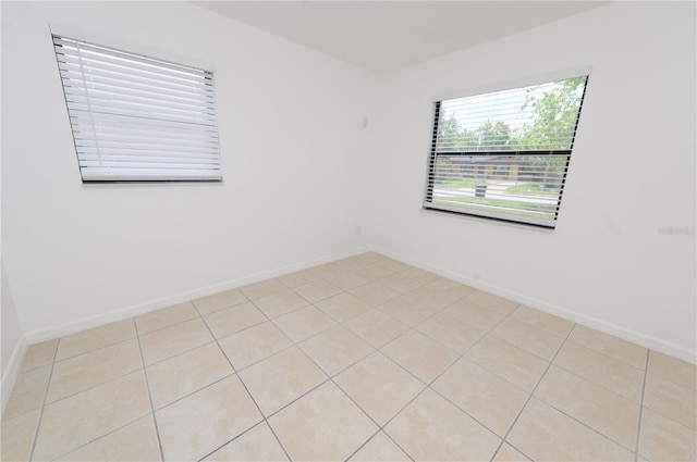 4469 Evers Pl, Orlando, FL 32811 - spare room with light tile patterned flooring