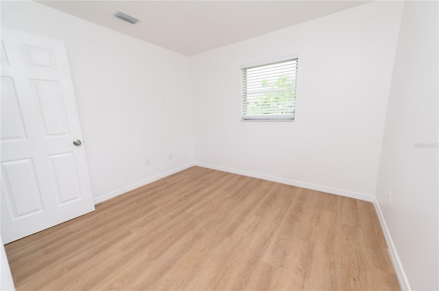 4469 Evers Pl, Orlando, FL 32811 - spare room featuring light wood-style flooring and baseboards