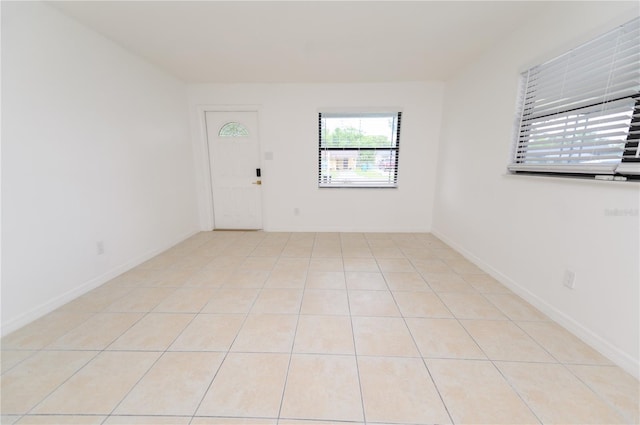 4469 Evers Pl, Orlando, FL 32811 - empty room with light tile patterned flooring