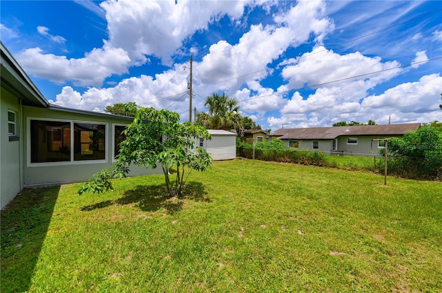 4469 Evers Pl, Orlando, FL 32811 - view of yard featuring a storage unit