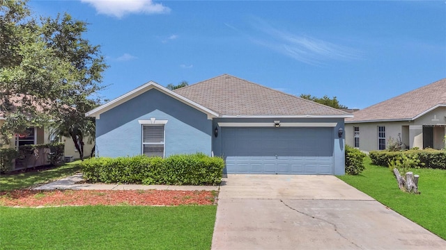 5145 Prairie View Way, Wesley Chapel, FL 33545 - single story home featuring concrete driveway, a front yard, an attached garage, and stucco siding