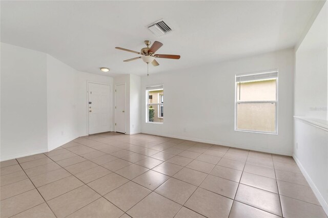 5145 Prairie View Way, Wesley Chapel, FL 33545 - spare room with light tile patterned floors and ceiling fan