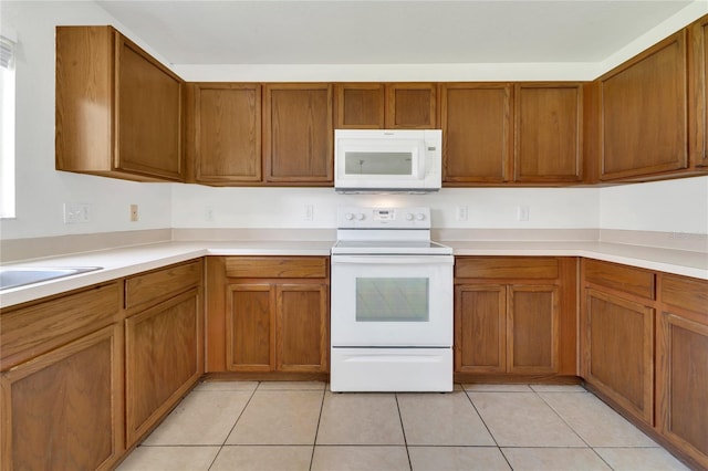 5145 Prairie View Way, Wesley Chapel, FL 33545 - kitchen with white appliances, brown cabinetry, and light countertops