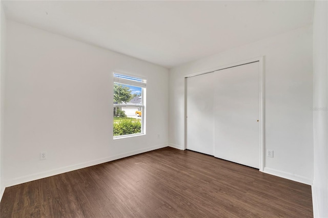 5145 Prairie View Way, Wesley Chapel, FL 33545 - unfurnished bedroom with wood finished floors and a closet