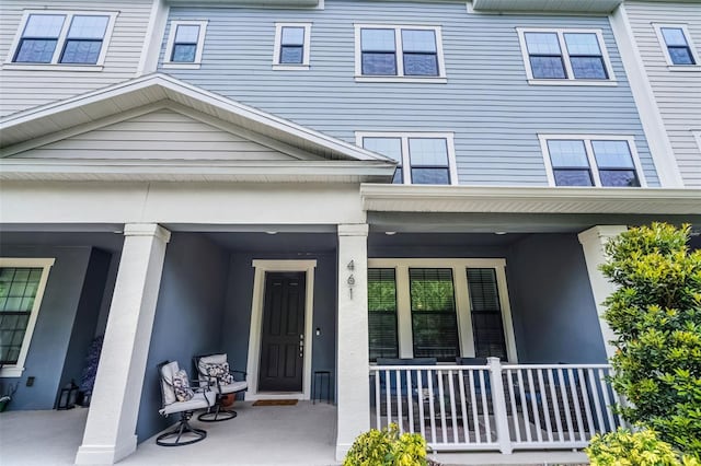 461 Diamond Dove Cv, Winter Springs, FL 32708 - view of exterior entry with covered porch and stucco siding