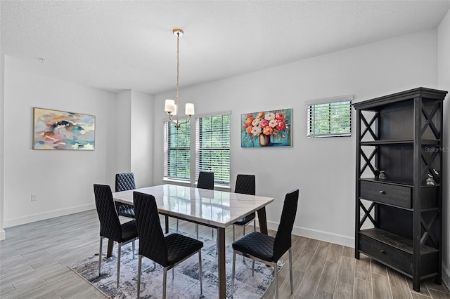 461 Diamond Dove Cv, Winter Springs, FL 32708 - dining space featuring healthy amount of natural light, light wood-type flooring, and a chandelier