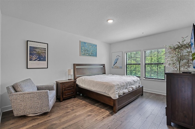 461 Diamond Dove Cv, Winter Springs, FL 32708 - bedroom with wood finished floors and a textured ceiling