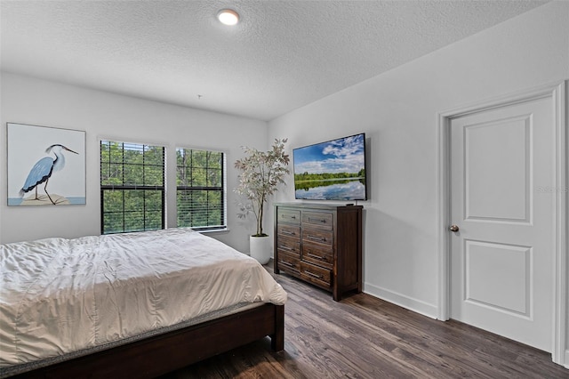 461 Diamond Dove Cv, Winter Springs, FL 32708 - bedroom with dark wood finished floors and a textured ceiling