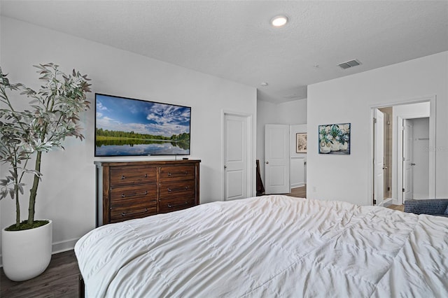 461 Diamond Dove Cv, Winter Springs, FL 32708 - bedroom with dark wood-style flooring and a textured ceiling