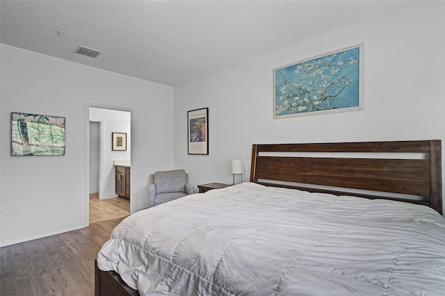 461 Diamond Dove Cv, Winter Springs, FL 32708 - bedroom with wood finished floors and connected bathroom