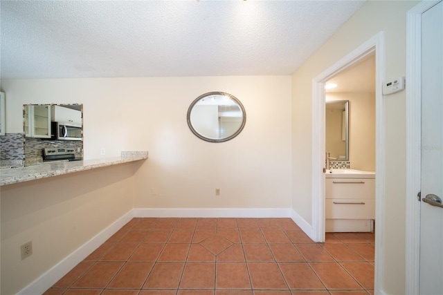 5365 Elm Ct Unit 331, Orlando, FL 32811 - unfurnished room featuring tile patterned floors and a textured ceiling