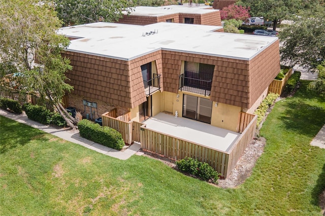 5365 Elm Ct Unit 331, Orlando, FL 32811 - rear view of house featuring a balcony and mansard roof