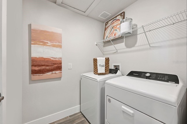 2563 Long Pine Ave, Apopka, FL 32712 - washroom featuring washer and clothes dryer, attic access, and dark wood-style floors