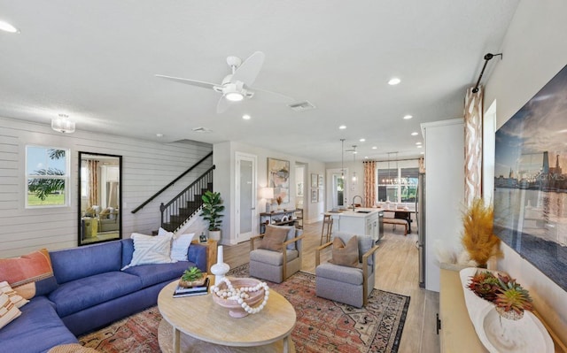 2563 Long Pine Ave, Apopka, FL 32712 - living area with stairway, light wood finished floors, recessed lighting, and a ceiling fan