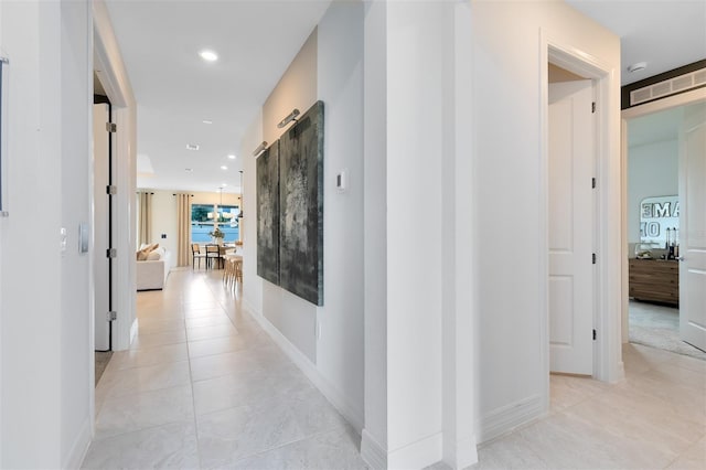 1530 Groveline Rd, Saint Cloud, FL 34771 - hall with light tile patterned floors and recessed lighting