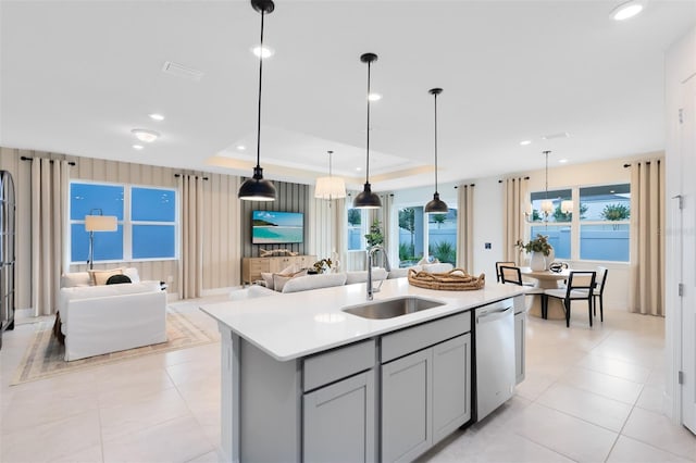 1530 Groveline Rd, Saint Cloud, FL 34771 - kitchen featuring stainless steel dishwasher, gray cabinets, light countertops, open floor plan, and recessed lighting