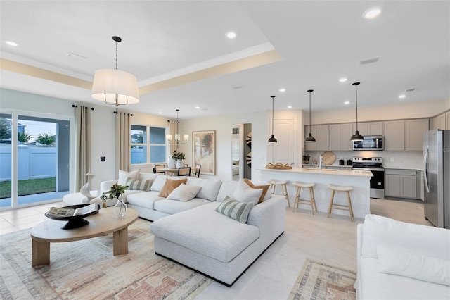1530 Groveline Rd, Saint Cloud, FL 34771 - living room with recessed lighting, light tile patterned floors, and a chandelier