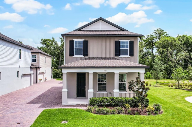 505 Venetian Palms Blvd, New Smyrna Beach, FL 32168 - view of front of property with board and batten siding, driveway, roof with shingles, and covered porch