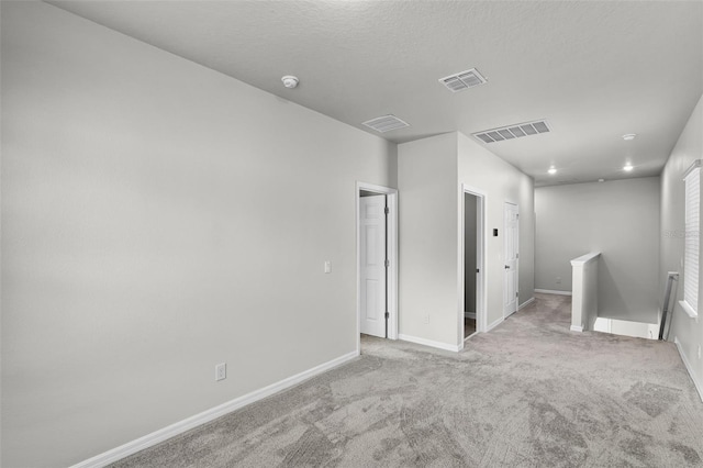 505 Venetian Palms Blvd, New Smyrna Beach, FL 32168 - carpeted spare room featuring baseboards and a smoke detector