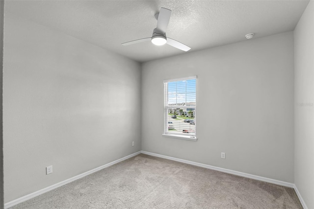 505 Venetian Palms Blvd, New Smyrna Beach, FL 32168 - carpeted empty room with a smoke detector, ceiling fan, and a textured ceiling