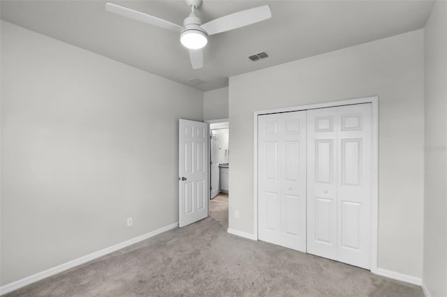 505 Venetian Palms Blvd, New Smyrna Beach, FL 32168 - unfurnished bedroom with carpet flooring, a closet, and ceiling fan