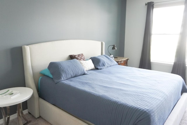 bedroom with light carpet