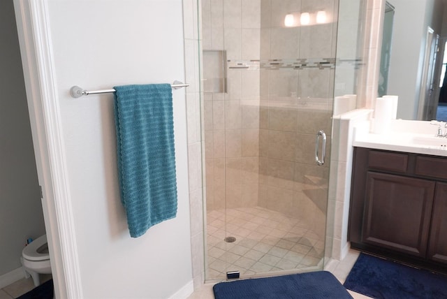 bathroom with a stall shower and vanity