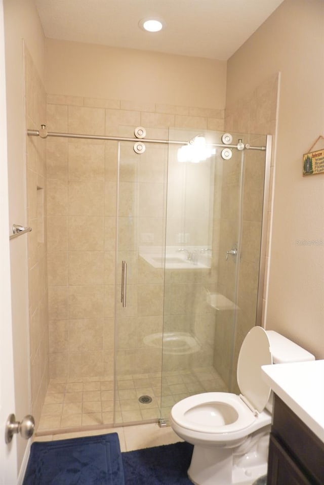 full bathroom featuring vanity and a stall shower