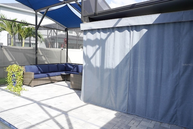view of patio / terrace featuring an outdoor hangout area and a lanai