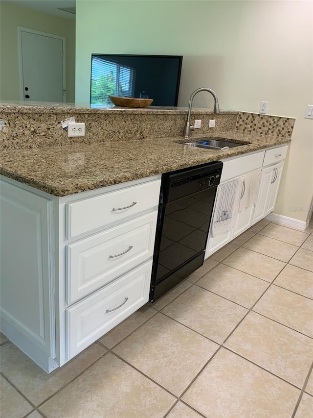 1409 Yorkshire St, Port Charlotte, FL 33952 - kitchen with dishwasher, light tile patterned floors, white cabinets, and dark stone counters