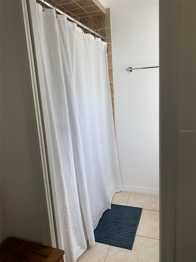 1409 Yorkshire St, Port Charlotte, FL 33952 - full bath with tile patterned floors and a shower with shower curtain